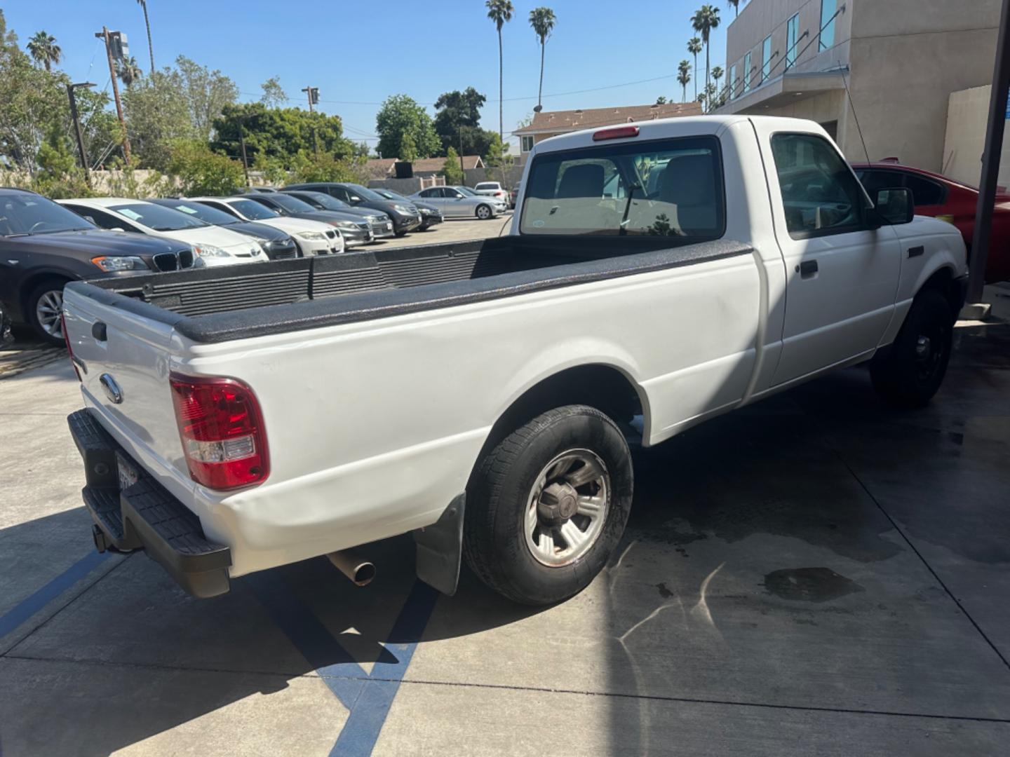 2011 WHITE /GRAY Ford Ranger XL 2WD (1FTKR1AE9BP) with an 4.0L V6 SOHC 12V engine, AUTOMATIC transmission, located at 30 S. Berkeley Avenue, Pasadena, CA, 91107, (626) 248-7567, 34.145447, -118.109398 - Body Style 2-Door REGULAR CAB PICKUP 2-DR Trim XL 2WD Engine 4.0L V6 SOHC 12V Other Transmission AUTOMATIC Drivetrain RWD Ext. Color WHITE Int. Color GRAY Stock Number 7662 VIN 1FTKR1AE9BPA78334 Location Crown City Motors Pasadena, CA WORK TRUCK!!! Crown City Motors is a use - Photo#4